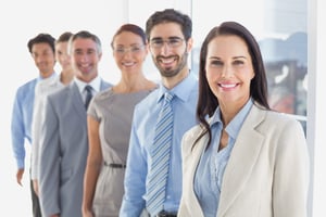 Smiling employee's in a line at work