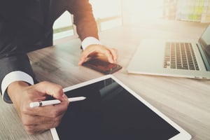 Man filing an IRS ECO Report for EV Credit